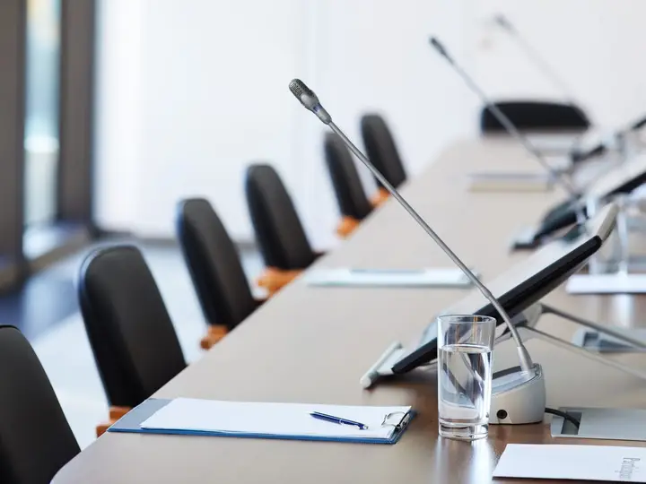 Boardroom table prepared for a meeting